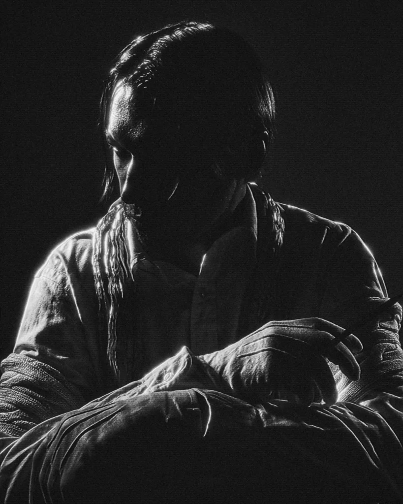 Dramatic black and white portrait of artist Vselenskyi in Baroque Chiaroscuro style, low light photography with deep shadows