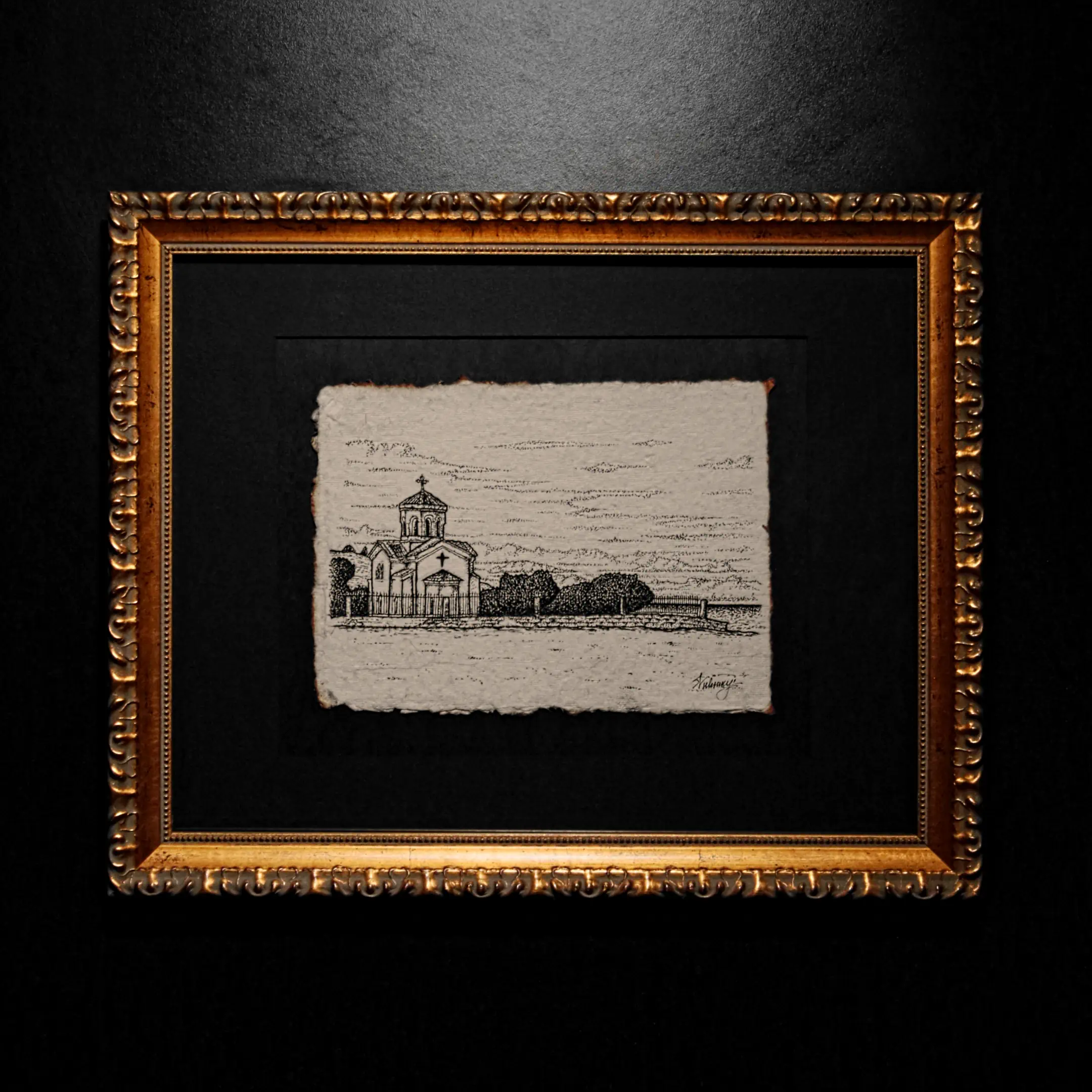 A black ink drawing of a domed chapel on textured handmade paper with deckled edges, mounted in an ornate gold frame.