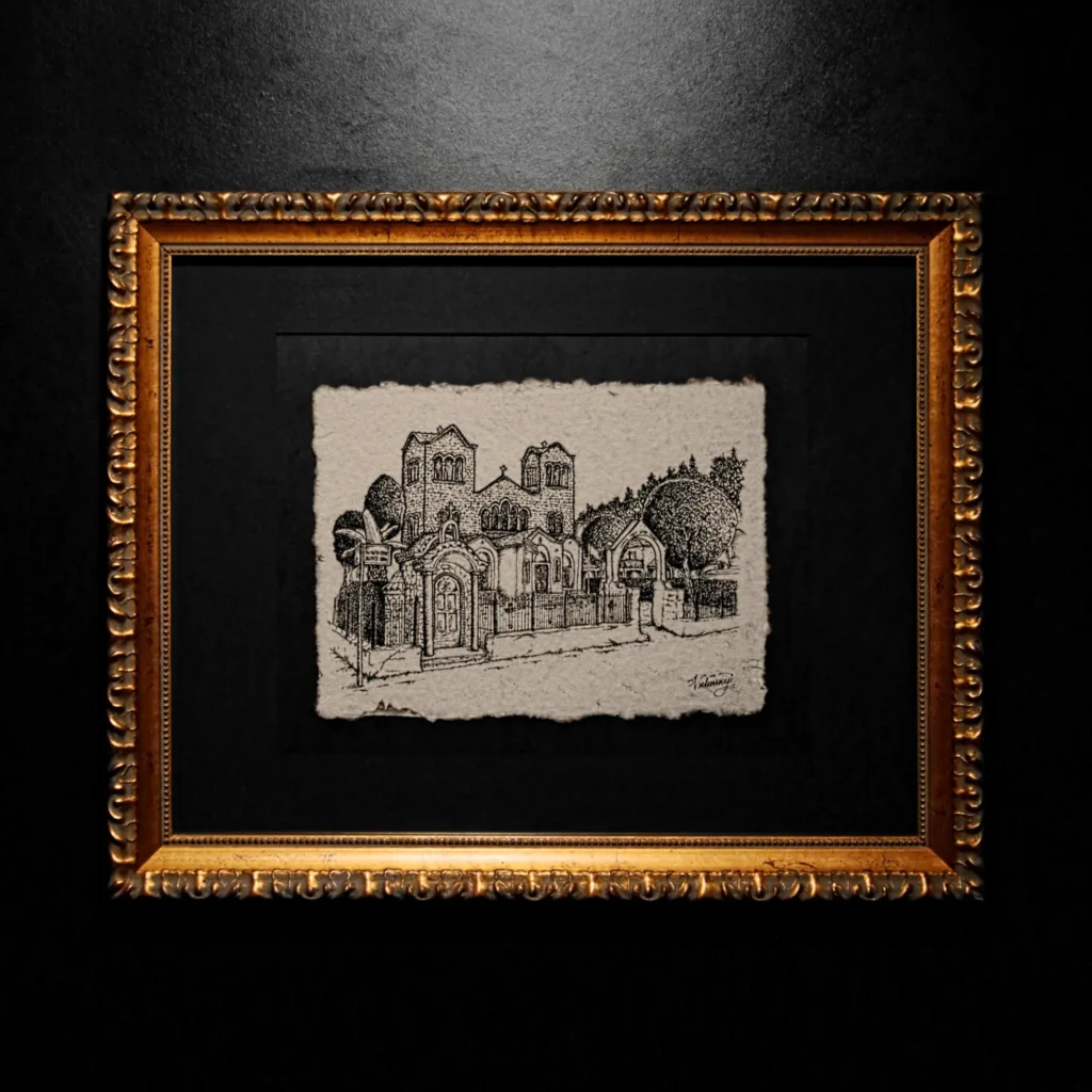A black ink architectural drawing of a classical building with two towers, created on textured handmade paper with deckled edges, set within a black mat and a gold ornate frame.
