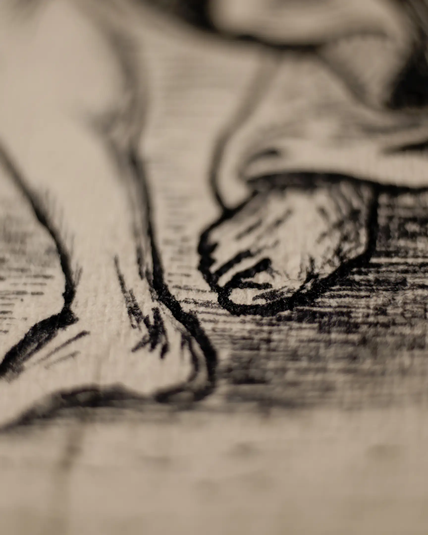 This fragment isolated the lower limbs of a figure. Two stylized bare feet are depicted, with the toes and heels defined by strong, expressive ink outlines. The focus is specifically on the form of the feet, which rest on a surface covered in dense, parallel horizontal hatching. The drawing technique highlights the play of light and shadow on the anatomical shapes against the rough paper texture.