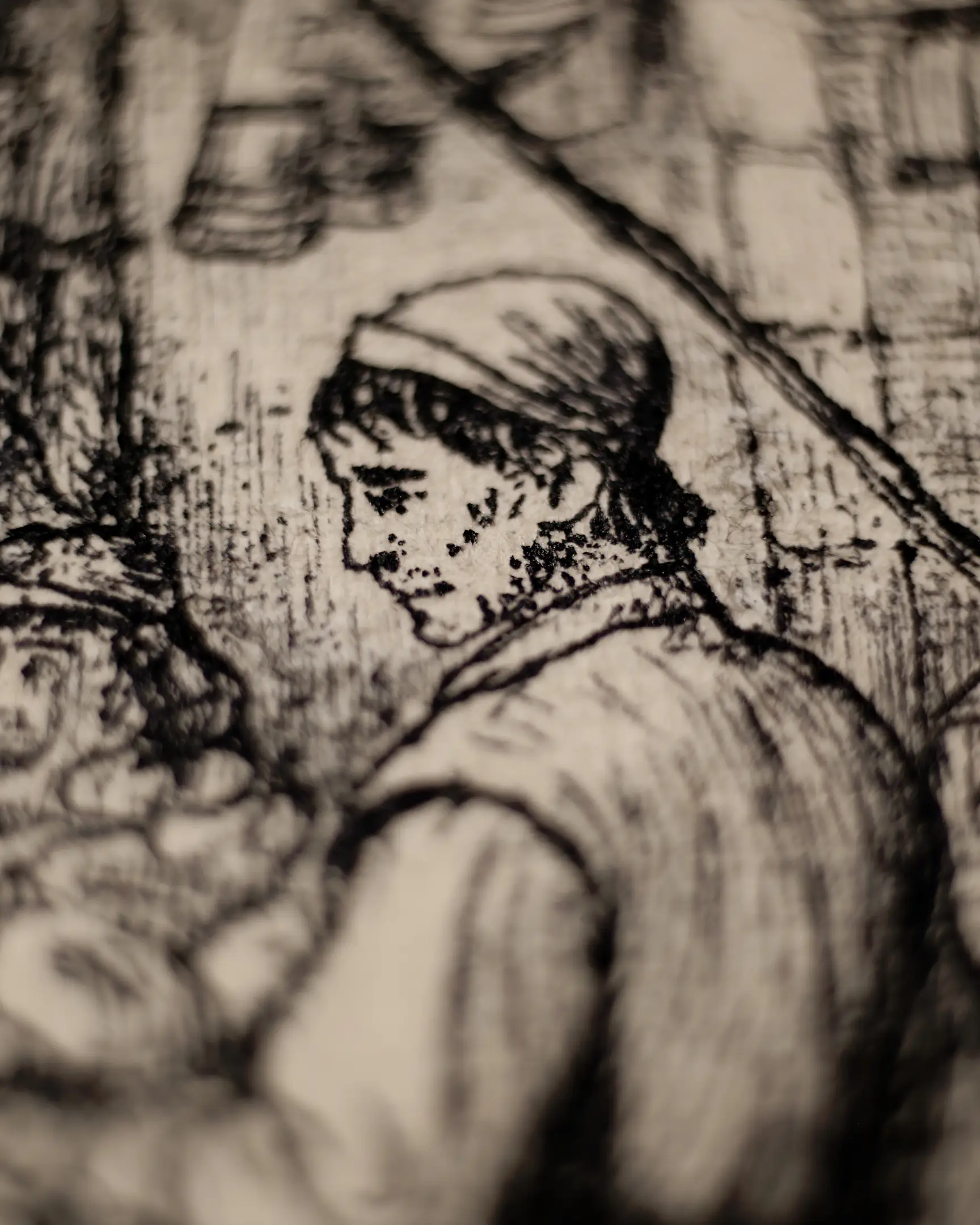 A macro shot of a print from a larger work, this image focuses on a bearded man in profile, his face rendered with dense, precise linework characteristic of old master etchings. He wears a traditional cap and a jerkin. The surrounding composition is partially blurred but hints at a narrative scene with other figures and architectural elements, all executed with rich, sepia-inked cross-hatching and dot patterns. The print has a warm, vintage patina. By the artist VSELENSKYI.