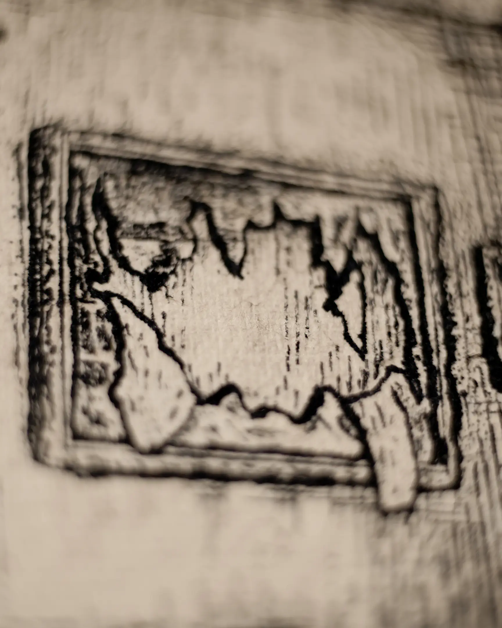 This macro shot highlights the organic interaction between the iron gall ink and the 18th-century paper. The deliberate blurring of the surrounding area draws the eye to the miniature frame, emphasizing the layered storytelling and historical atmosphere of the artwork.